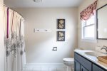 Large Ensuite bathroom off main floor master with tub/shower combo